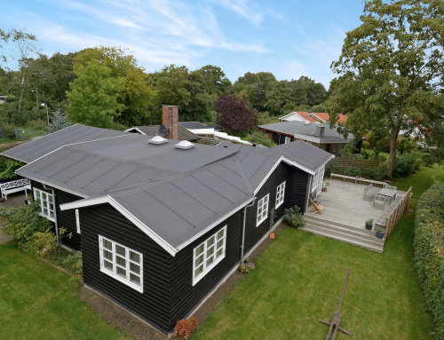 Nyt tagpaptag på skønt bjælkehus